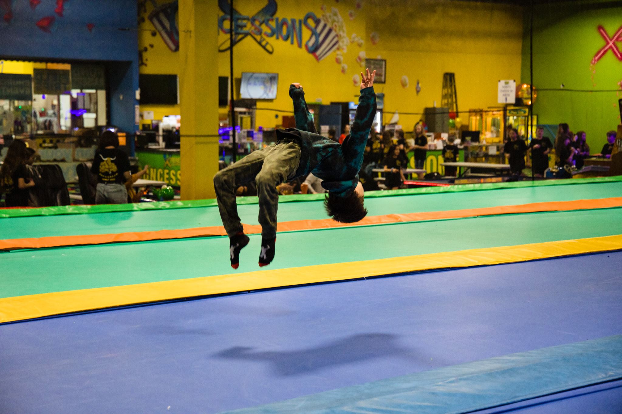 Image of a Kid Jumping on a Long Trampoline