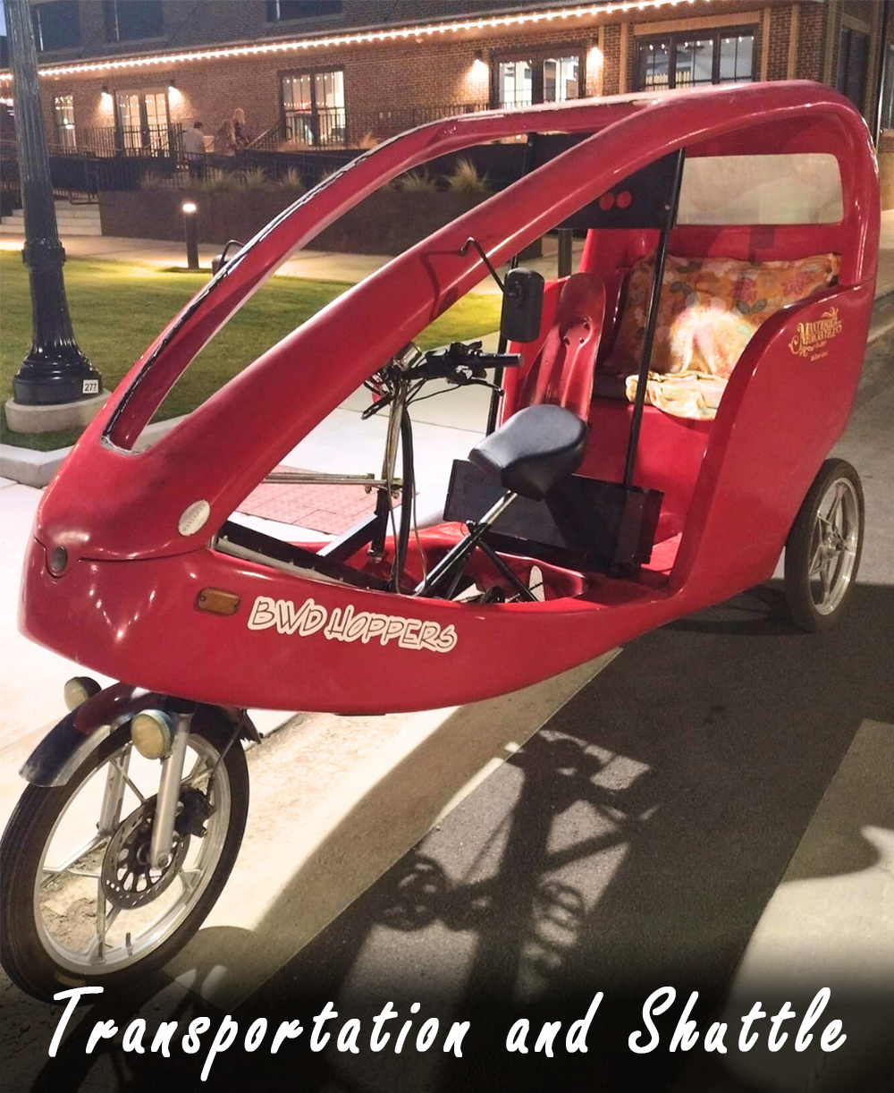 A small red shuttle with "transportation and shuttle" wording