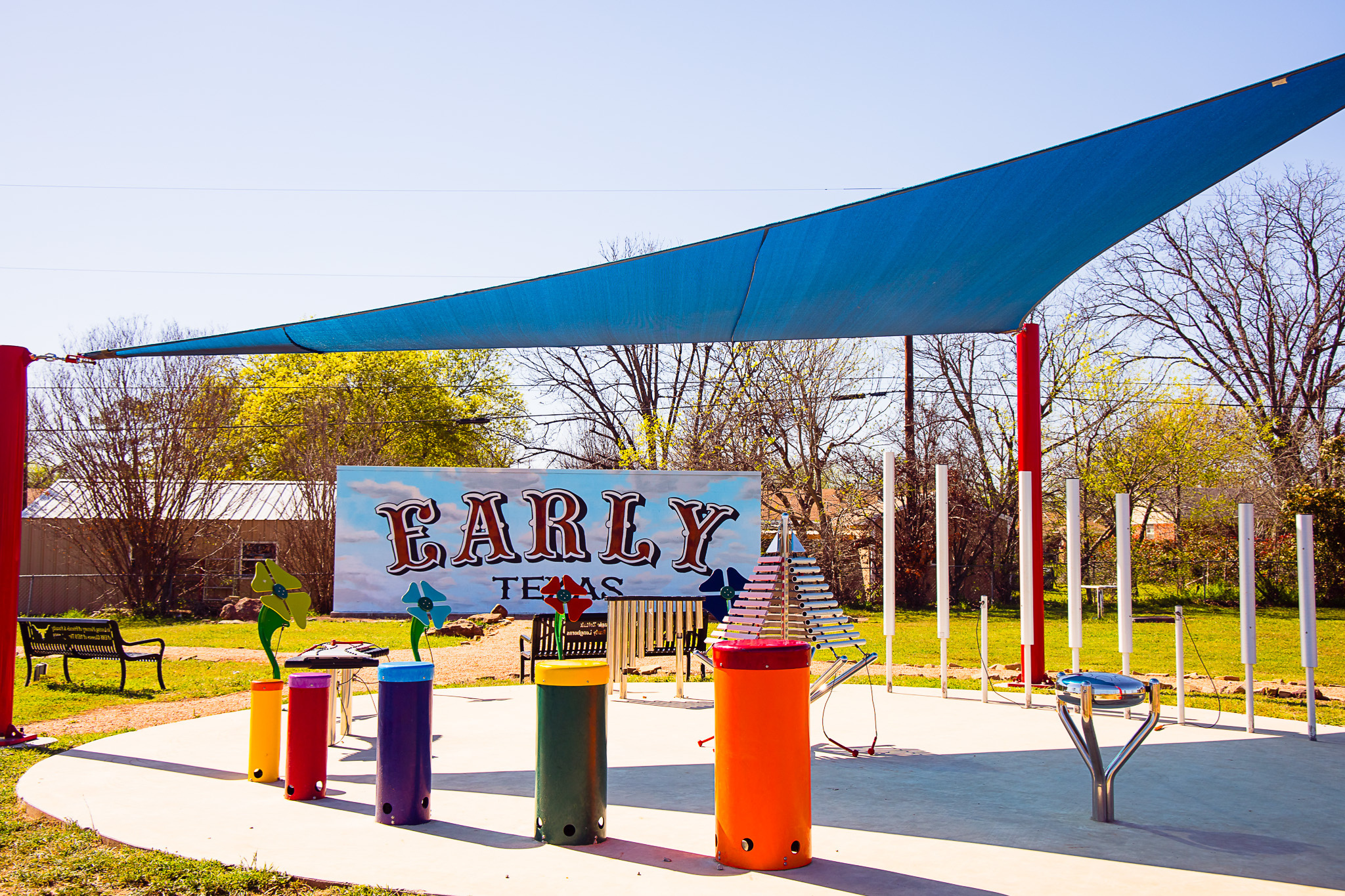 Picture of a sound garden in front of a Early, Texas mural