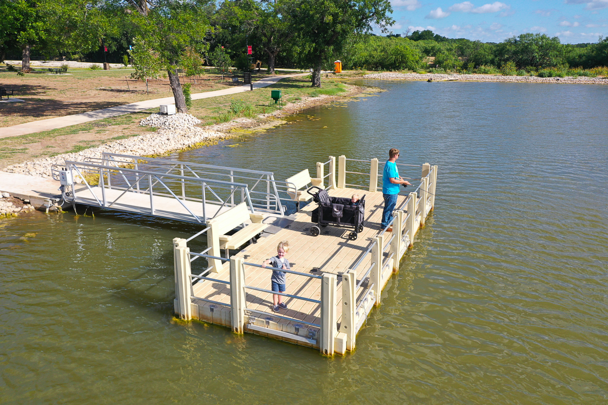 Picture of someone fishing at the lake on the fishing dock