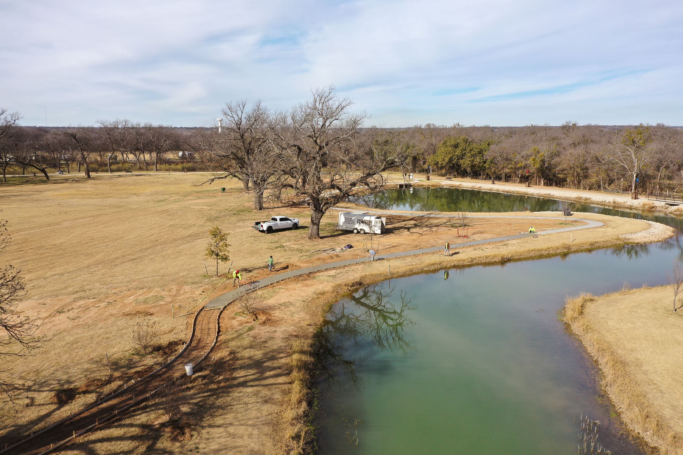 Drone picture of the lake with sidewalks being constructed 